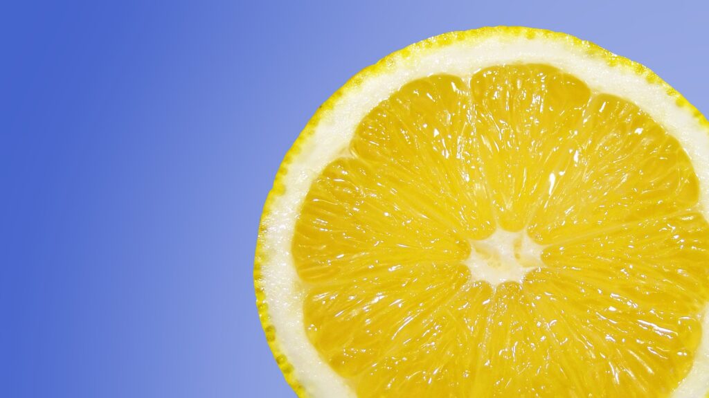Half lemon with blue background